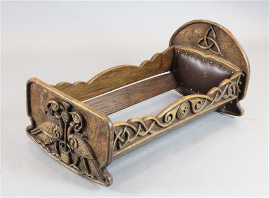 A Scottish Arts & Crafts carved elm cradle, W.1ft 9in.